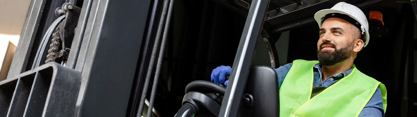 Worker in safety gear completing online workplace safety training