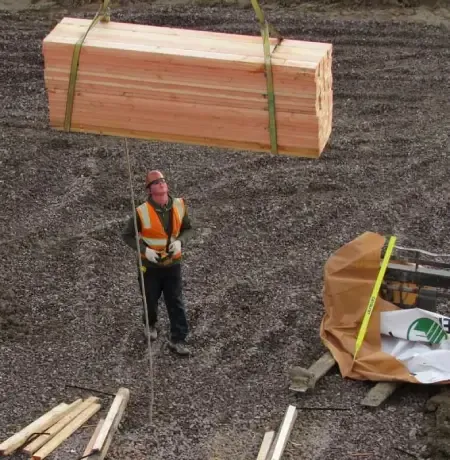 man-standing-near-a-lifted-load.webp