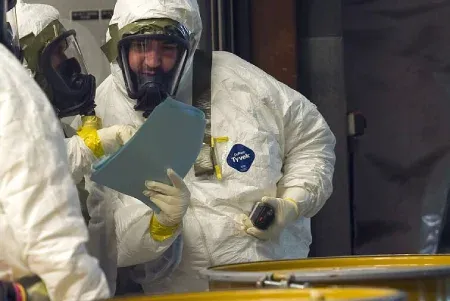 men-wearing-hazardous-material-suits.webp